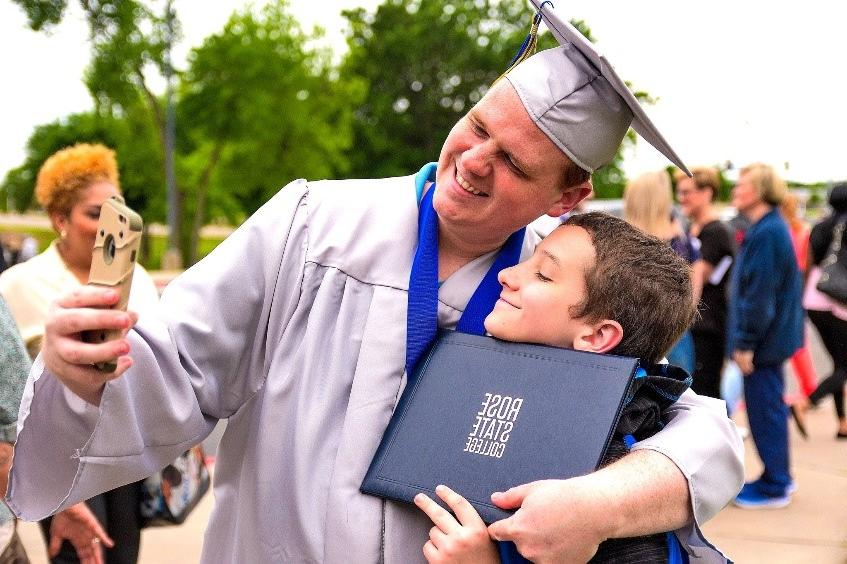 happy graduate and son